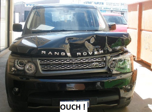 Range Rover with front-end collision damage before repair
