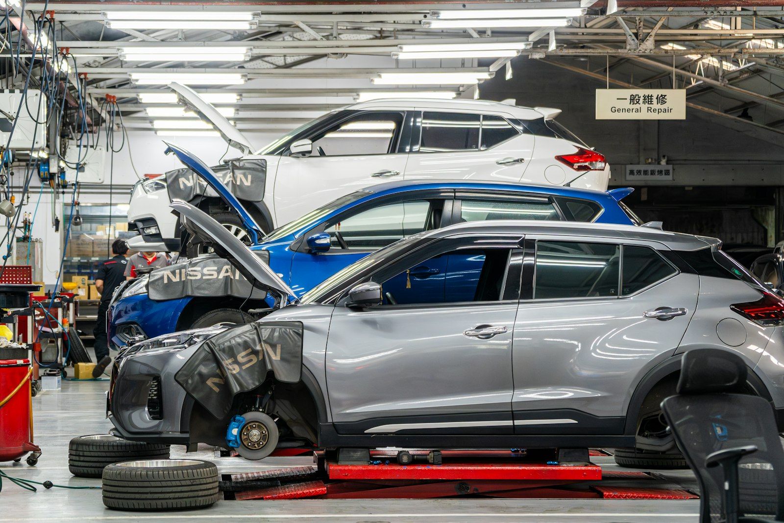 Inside the S&A Smash Repairs workshop with vehicles being repaired
